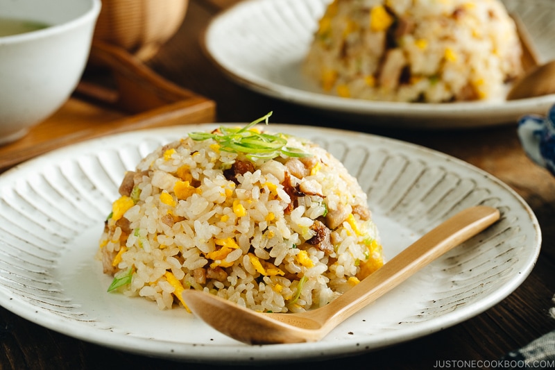 Chashu fried rice served on white plates.